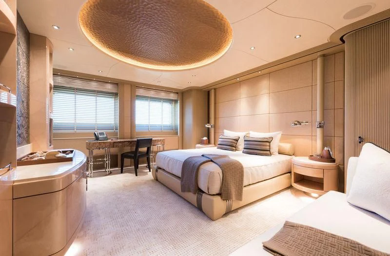 a room with a bed and a table aboard ROMEA Yacht for Sale