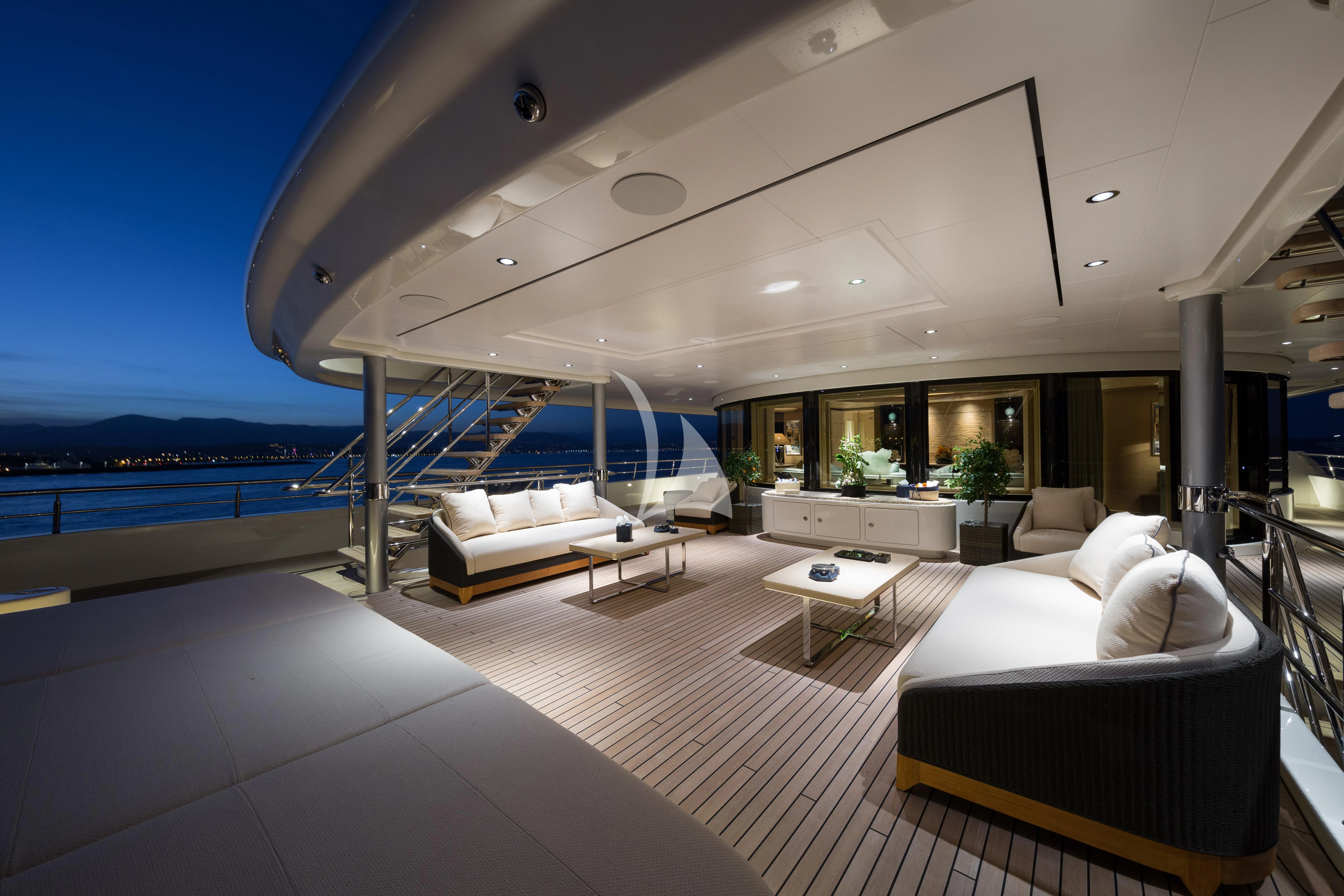 a large living room with a large balcony overlooking the ocean aboard ROMEA Yacht for Sale