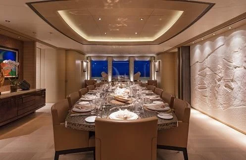 a large dining room with a large table and chairs aboard ROMEA Yacht for Sale