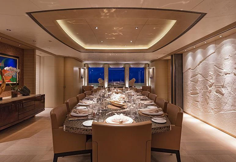 a large dining room with a large table and chairs aboard ROMEA Yacht for Sale