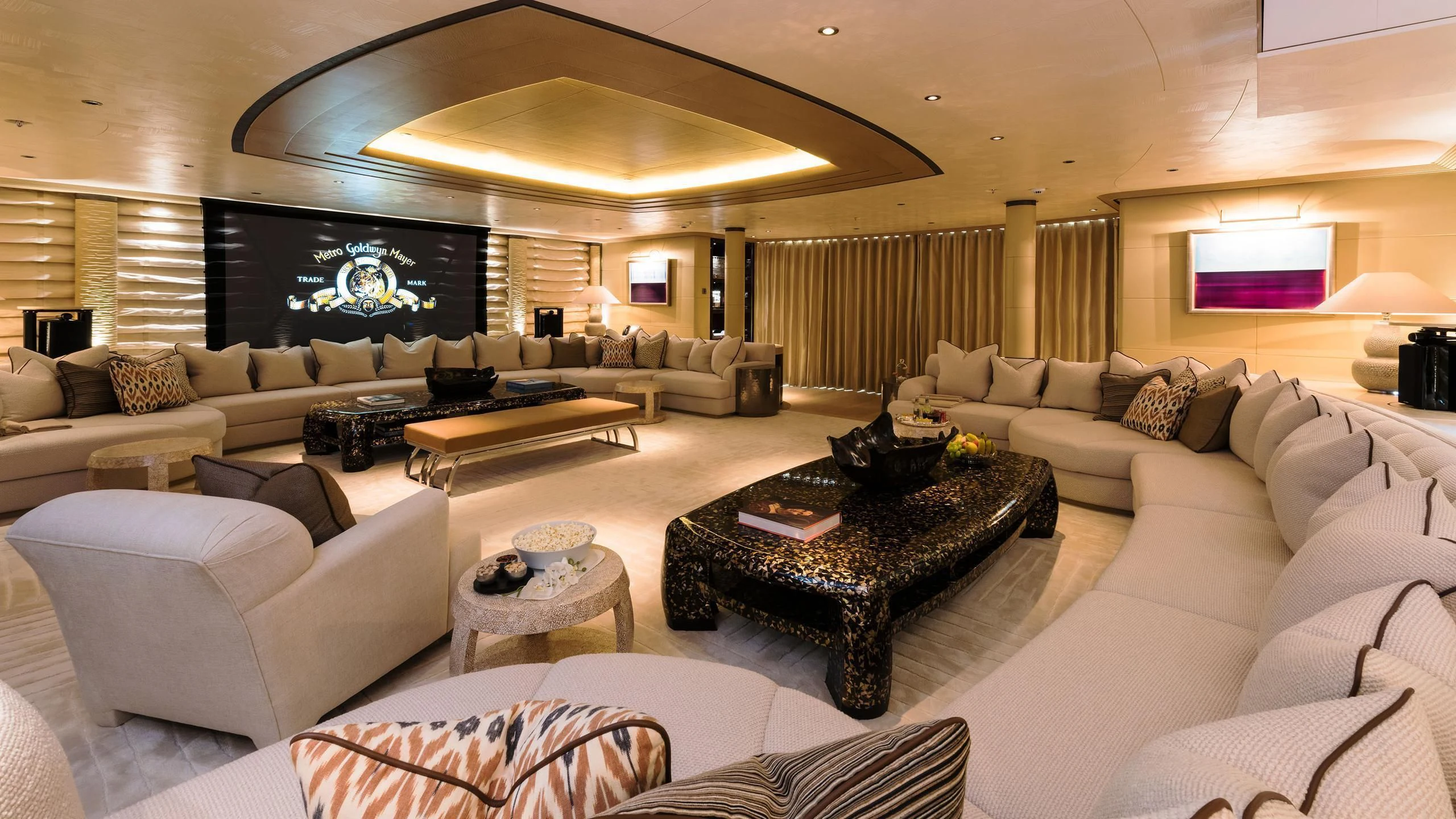 a large living room with a large screen aboard ROMEA Yacht for Sale