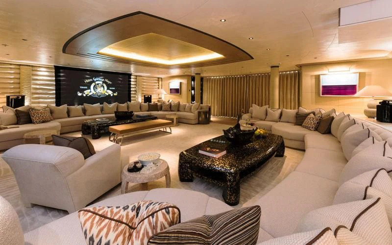 a living room with a large fireplace aboard ROMEA Yacht for Sale