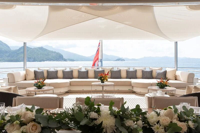 a large white tent with a table and chairs in front of it aboard ROMEA Yacht for Sale