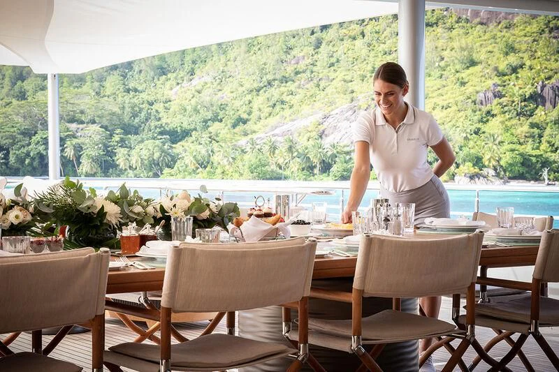 a person standing on a balcony aboard ROMEA Yacht for Sale