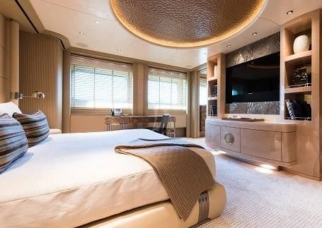 a bedroom with a bed and a television aboard ROMEA Yacht for Sale