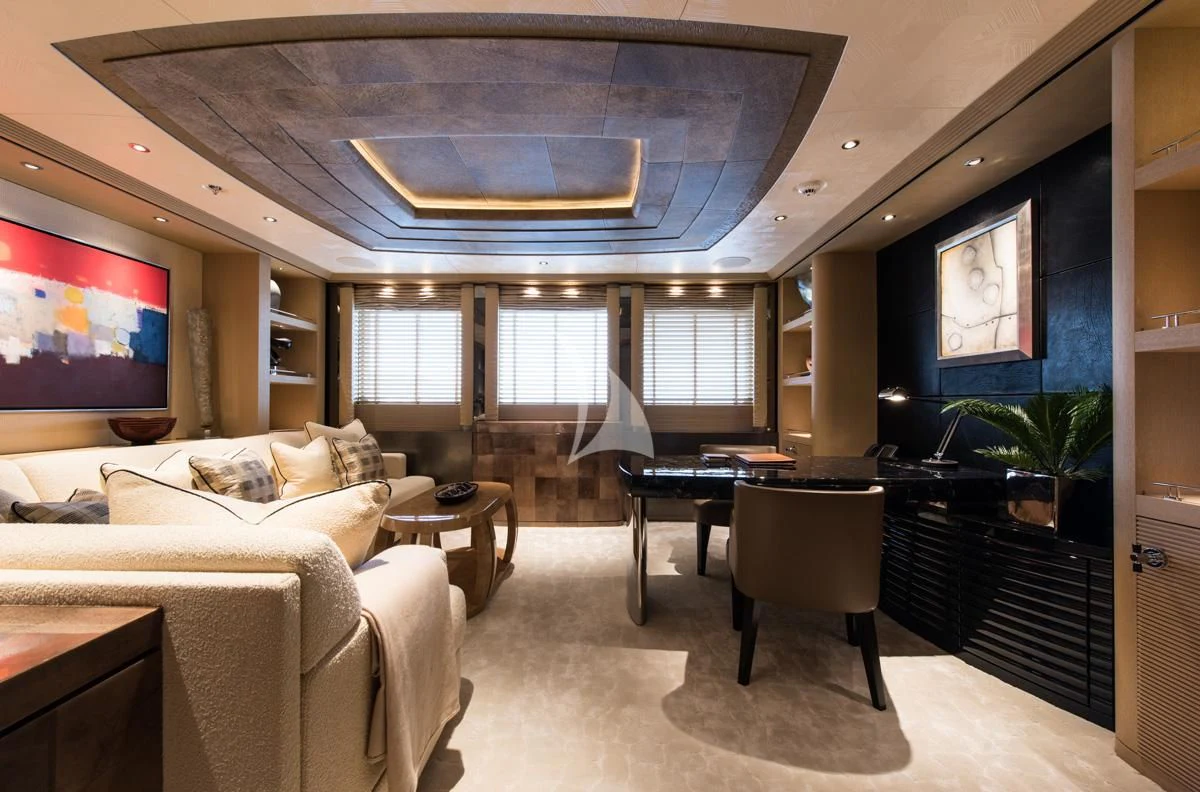 a living room with a large chandelier aboard ROMEA Yacht for Sale