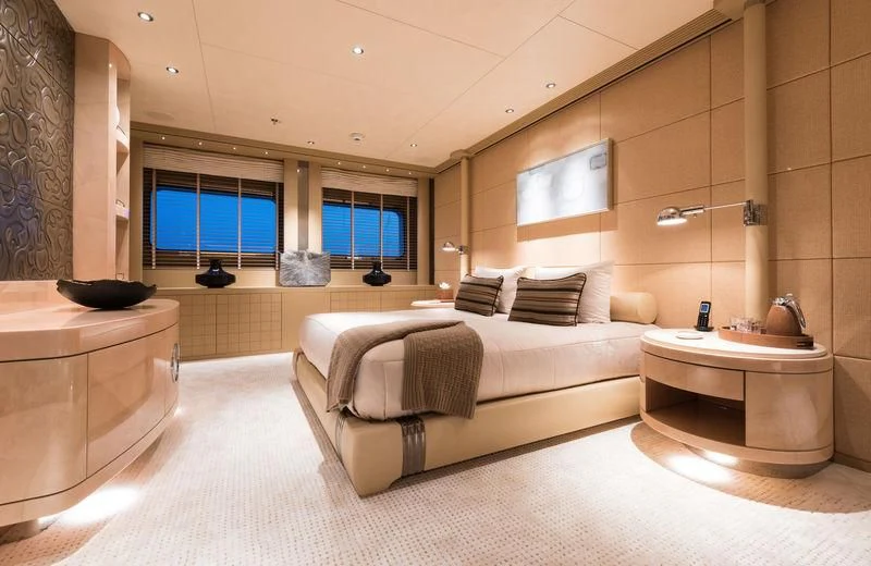 a large bedroom with a bed and a sink aboard ROMEA Yacht for Sale