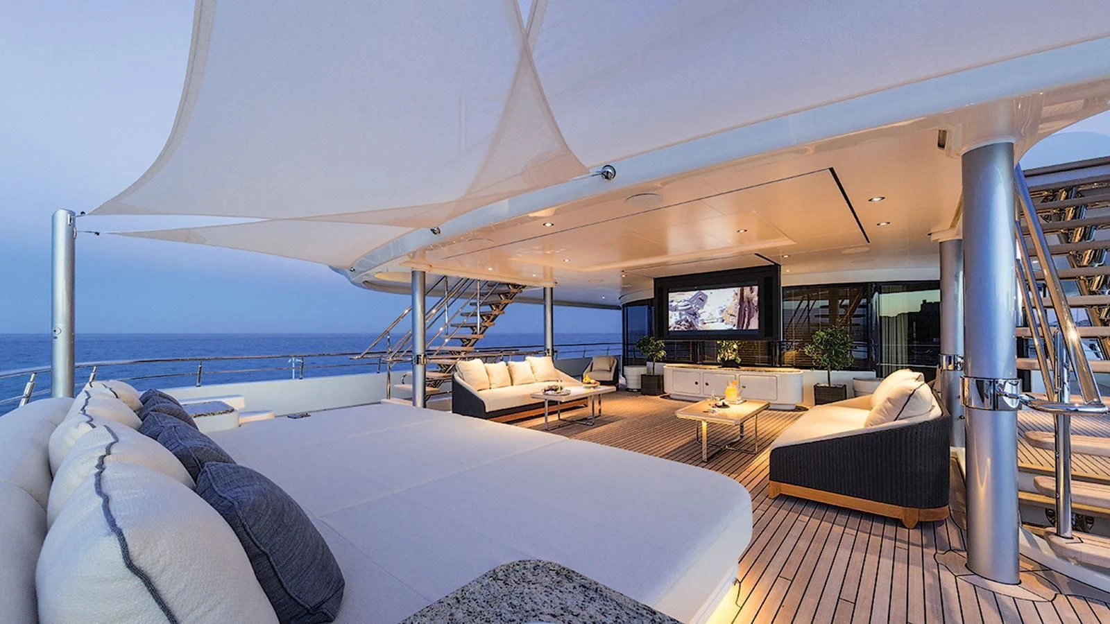 a large room with a bed and a tv aboard ROMEA Yacht for Sale