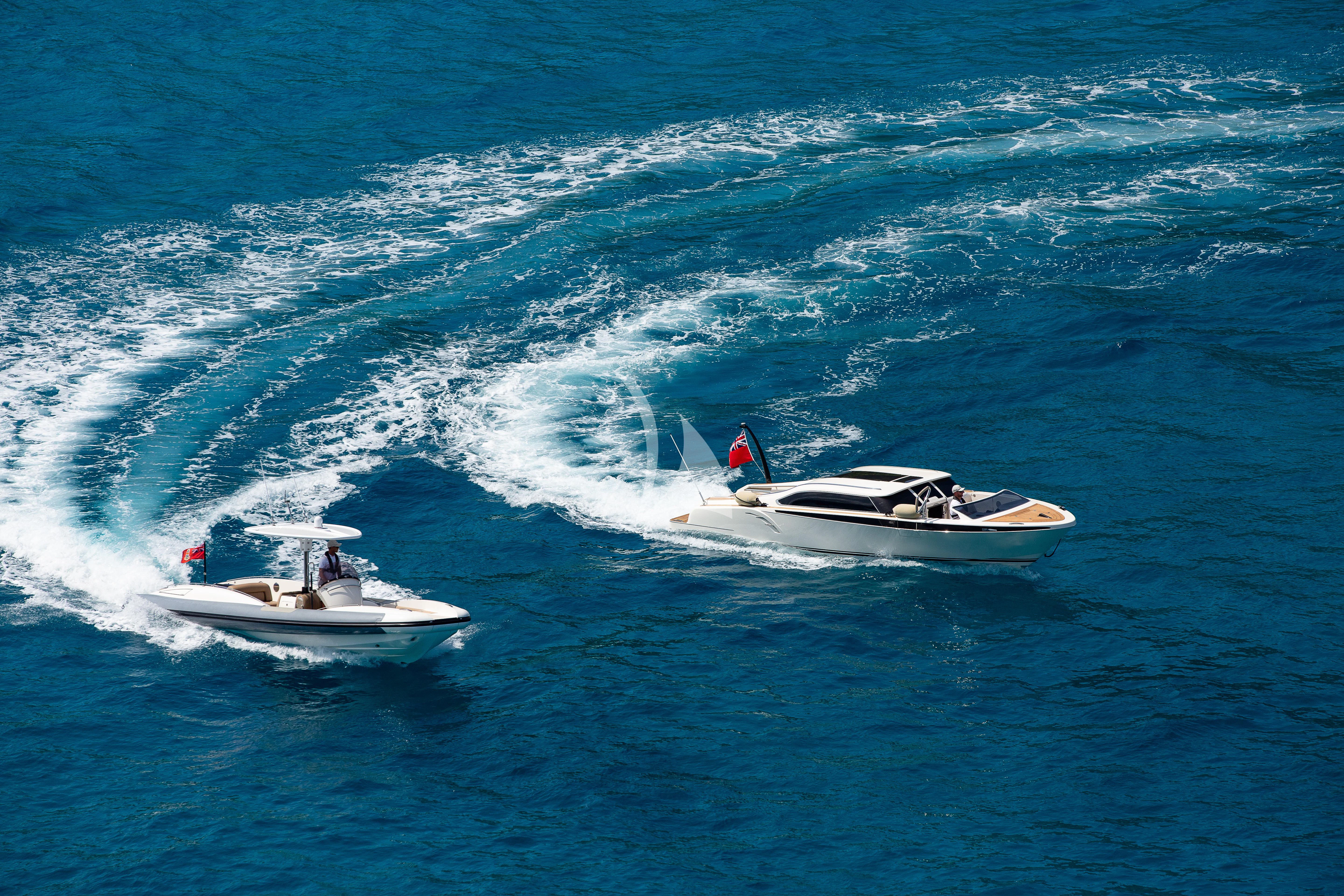 a boat and a couple of people in the water aboard ROMEA Yacht for Sale