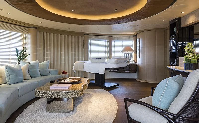 a living room with a large bed and a couch aboard ROMEA Yacht for Sale