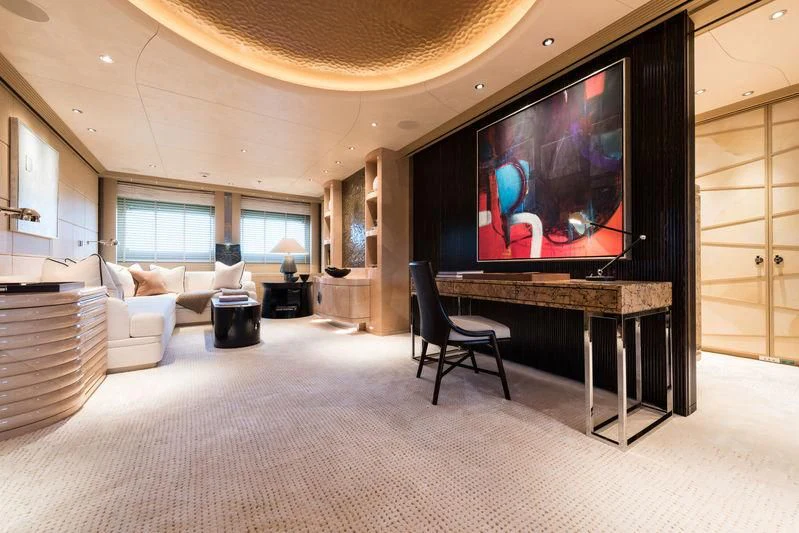 a large living room with a large screen aboard ROMEA Yacht for Sale
