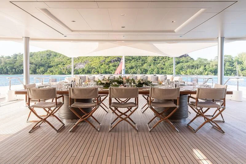 a group of chairs on a deck aboard ROMEA Yacht for Sale