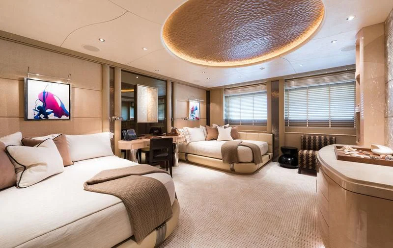 a large hotel room with a large bed and a flat screen tv aboard ROMEA Yacht for Sale