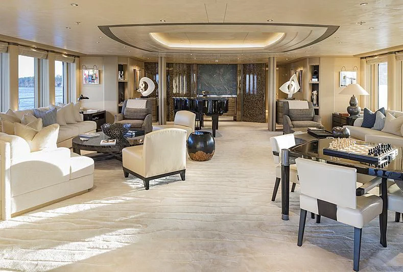 a living room with a piano aboard ROMEA Yacht for Sale