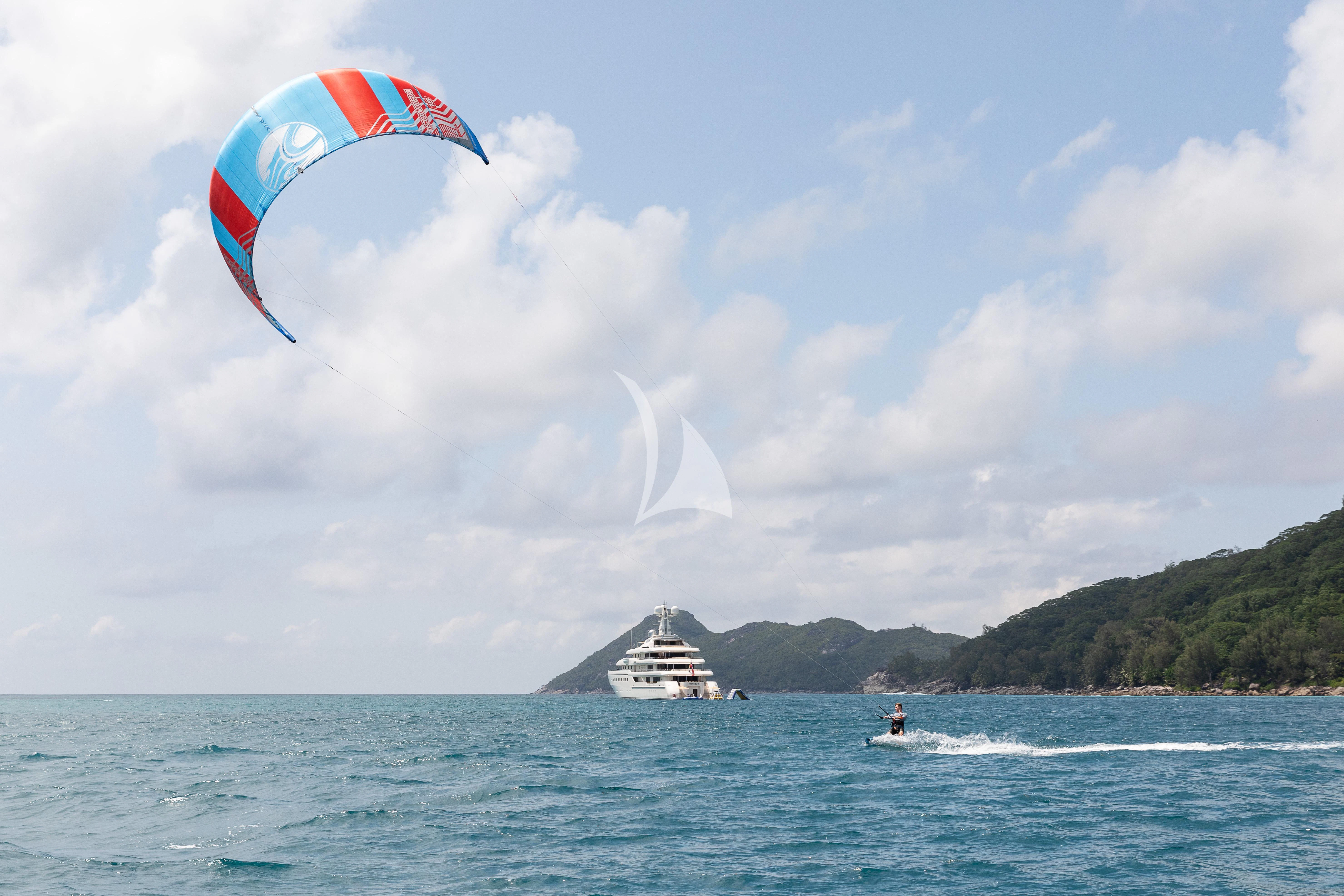 a person parasailing on a surfboard aboard ROMEA Yacht for Sale