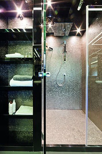 a room with a glass wall and a door with a glass door aboard LE CAPRICE IV Yacht for Sale