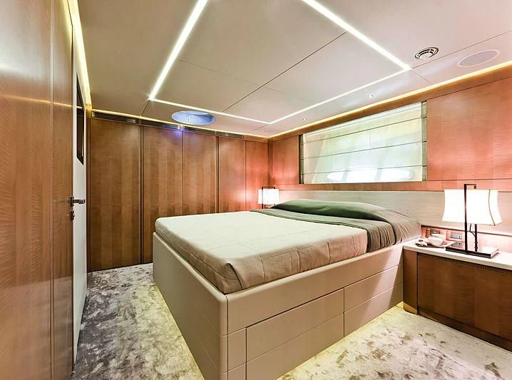 a room with a bed and a desk aboard LE CAPRICE IV Yacht for Sale