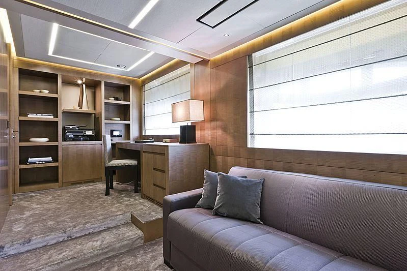a living room with a couch and a desk aboard LE CAPRICE IV Yacht for Sale