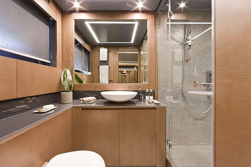 a bathroom with a sink and a shower aboard LE CAPRICE IV Yacht for Sale