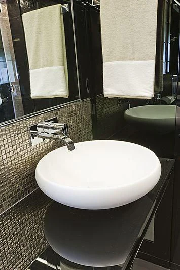 a bathroom with a sink and a mirror aboard LE CAPRICE IV Yacht for Sale