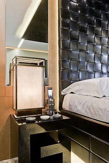 a bed sits next to a window aboard LE CAPRICE IV Yacht for Sale