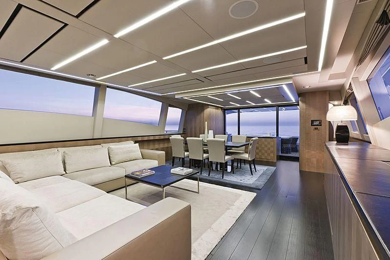 a room with a couch and a table aboard LE CAPRICE IV Yacht for Sale