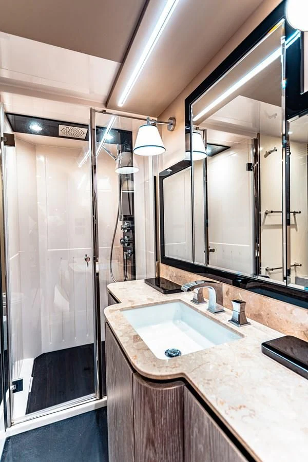 a bathroom with a large mirror aboard FAT BOY Yacht for Sale