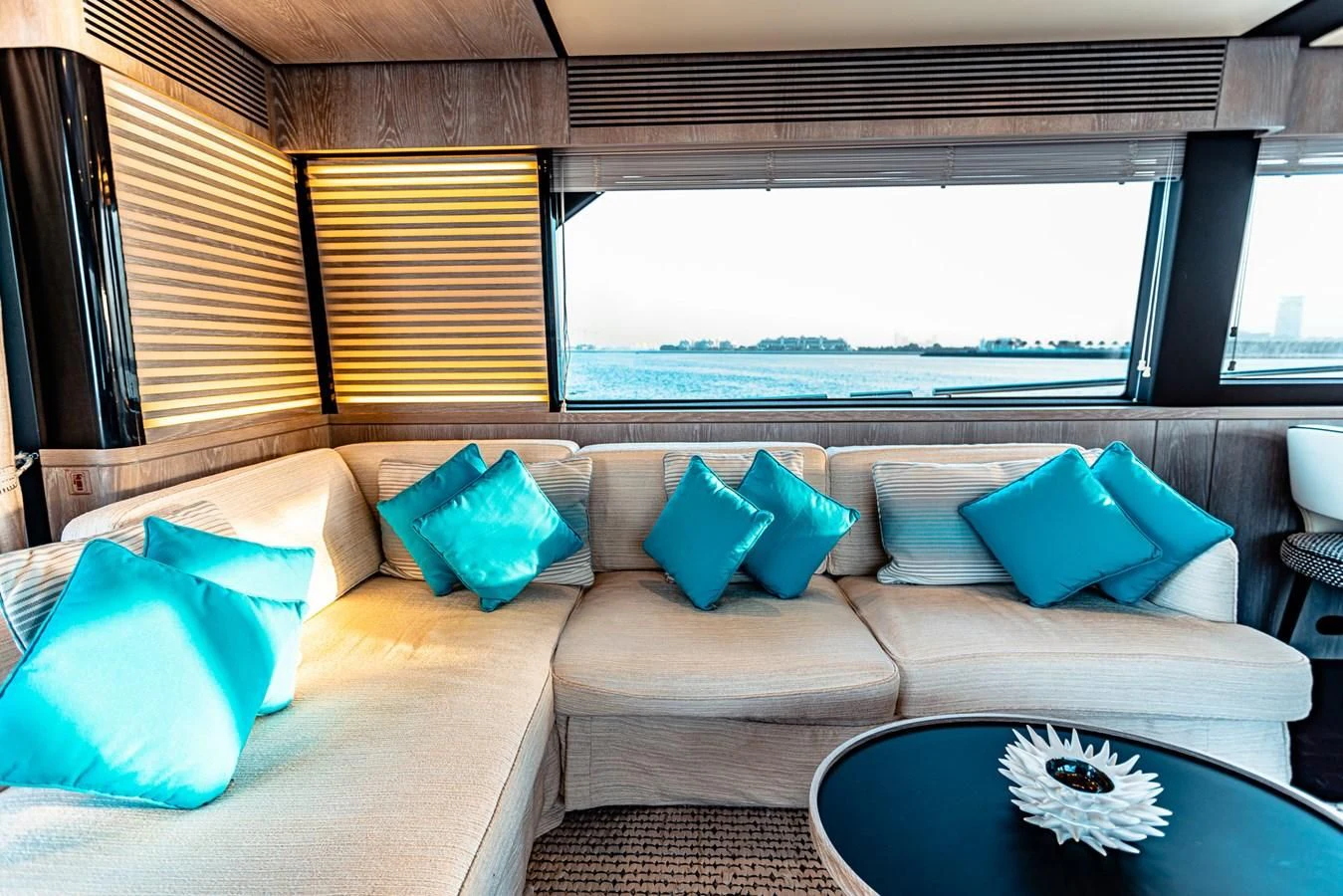 a couch with pillows on it aboard FAT BOY Yacht for Sale