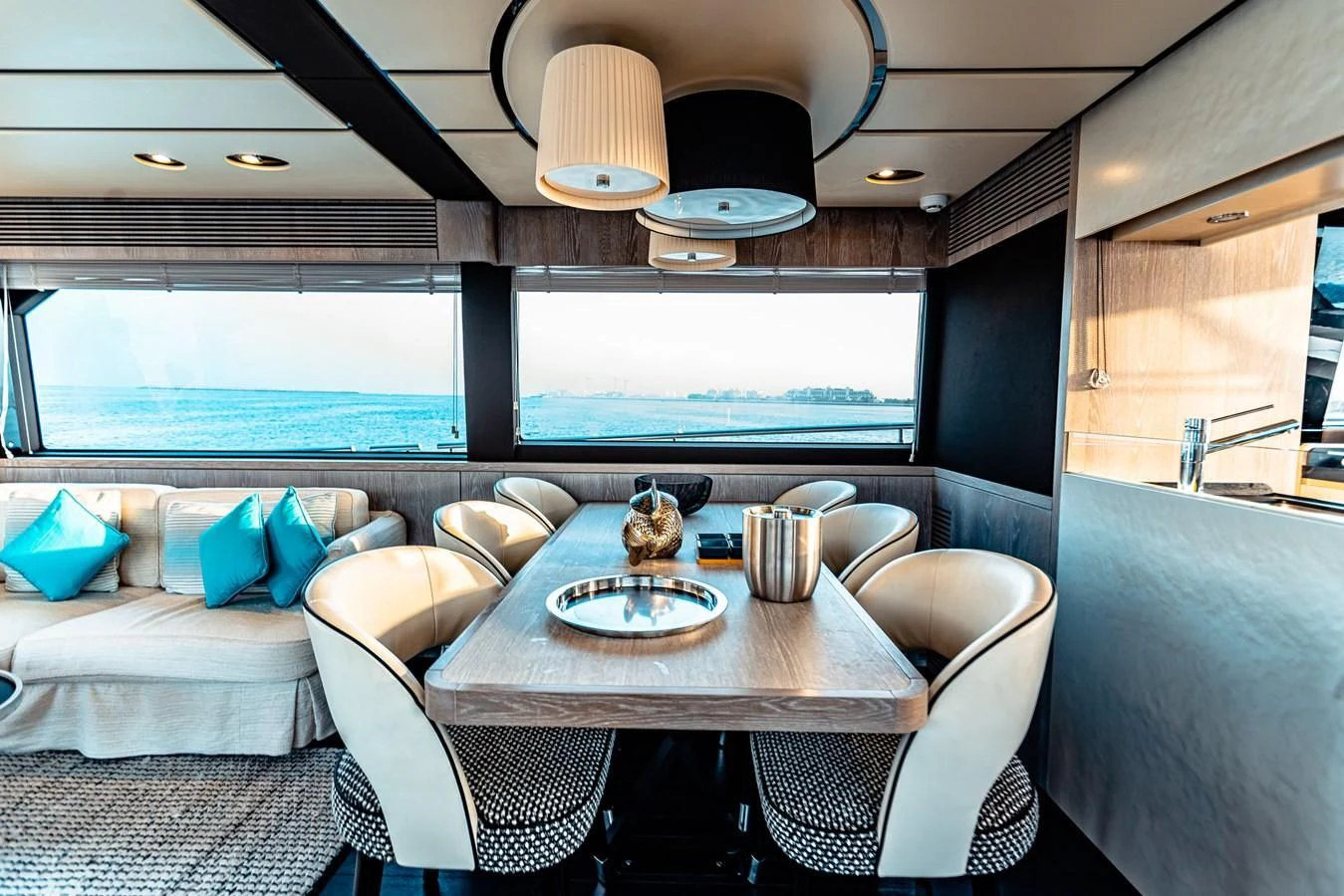 a dining table in a room aboard FAT BOY Yacht for Sale