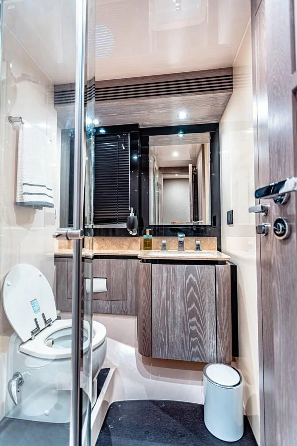 a bathroom with a toilet and a sink aboard FAT BOY Yacht for Sale
