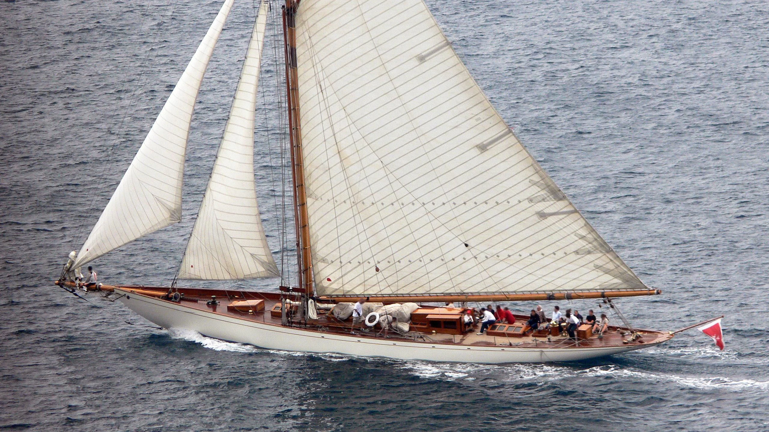 a sailboat with people on it aboard MOONBEAM IV Yacht for Sale