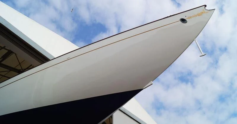 a white airplane in the sky aboard MOONBEAM IV Yacht for Sale