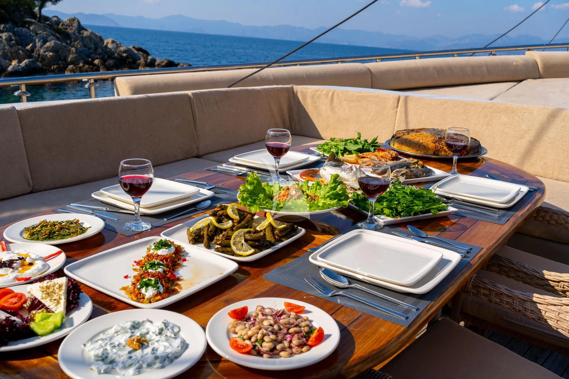 a table with food on it aboard ADMIRAL Yacht for Charter