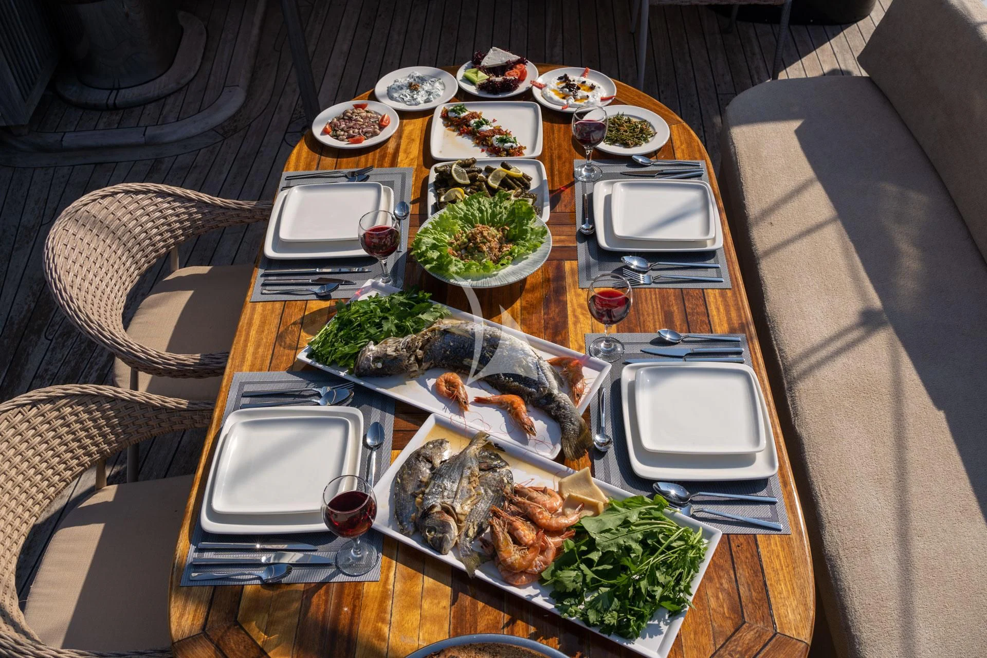 a table full of food aboard ADMIRAL Yacht for Charter