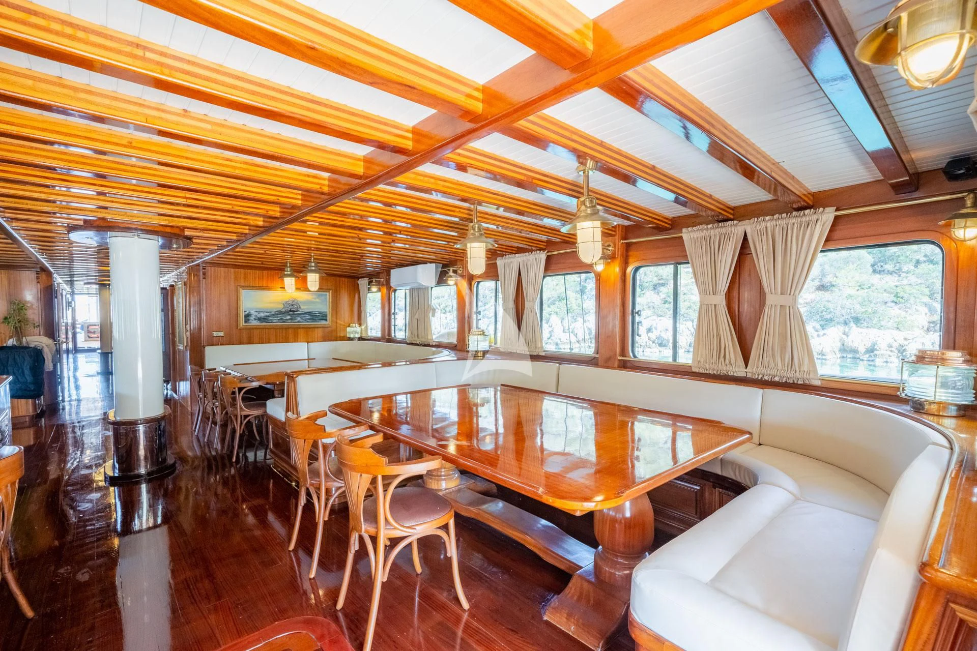 a room with a table and chairs aboard ADMIRAL Yacht for Charter