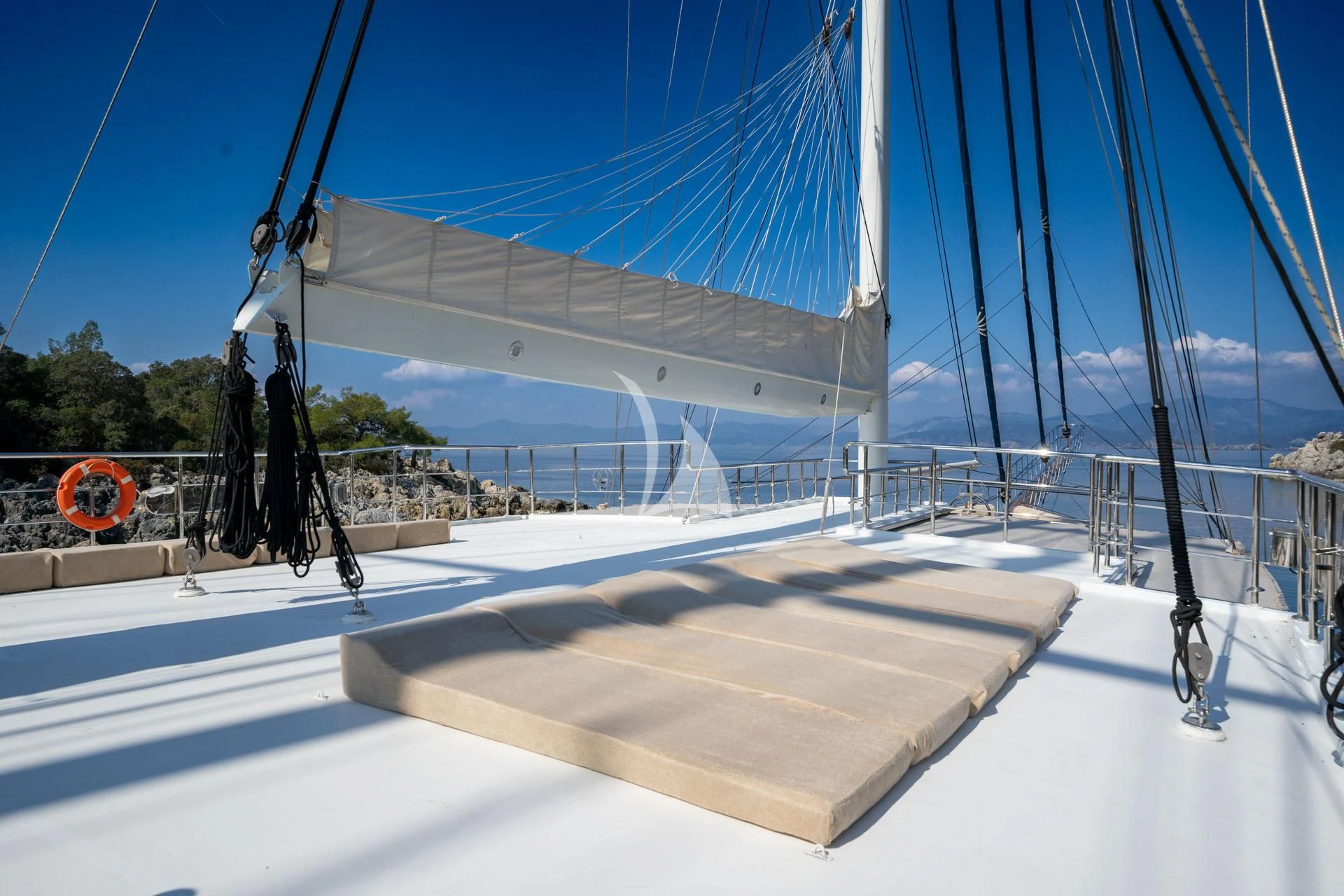 a large white sailboat on a dock aboard ADMIRAL Yacht for Charter