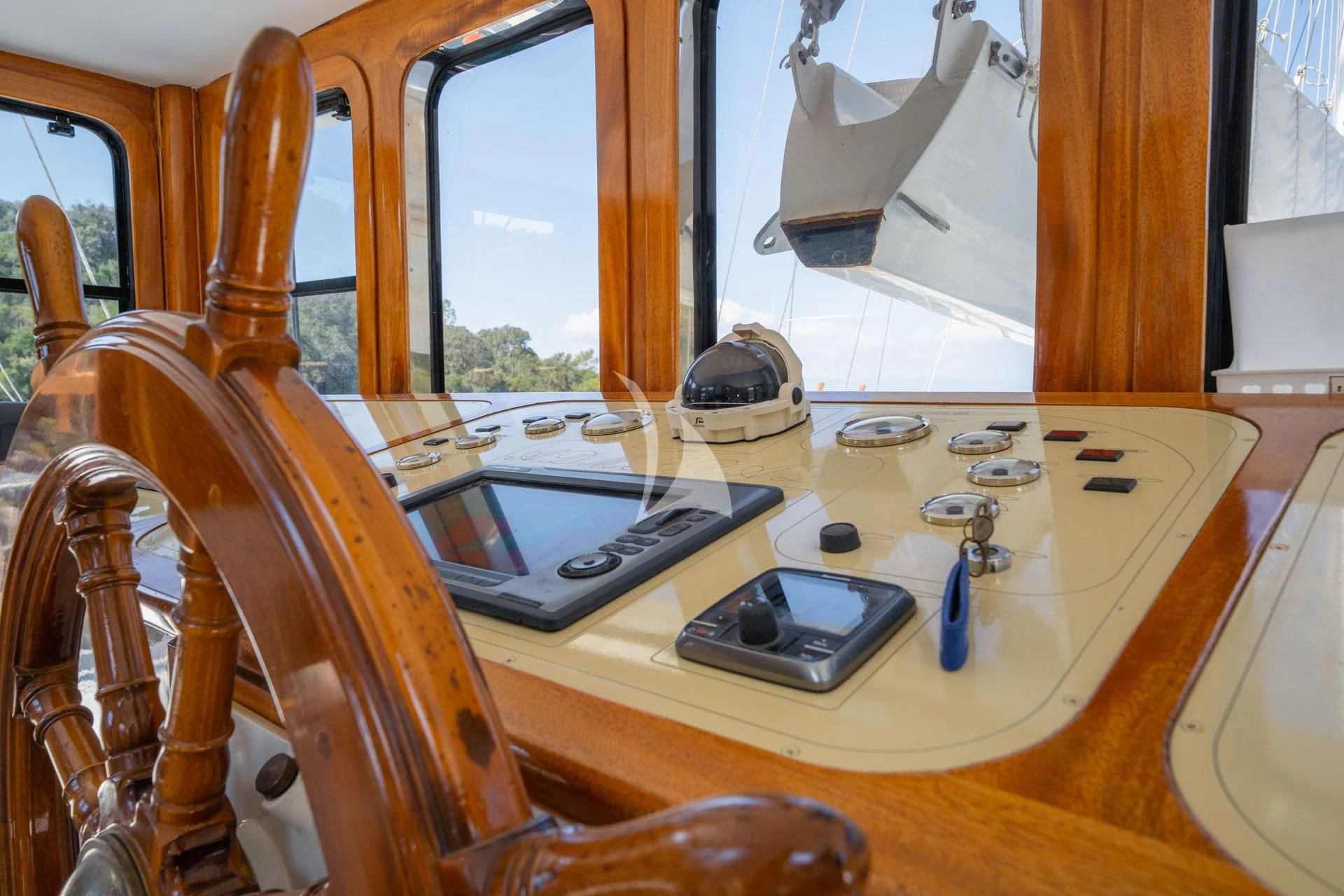 a phone on a table aboard ADMIRAL Yacht for Charter