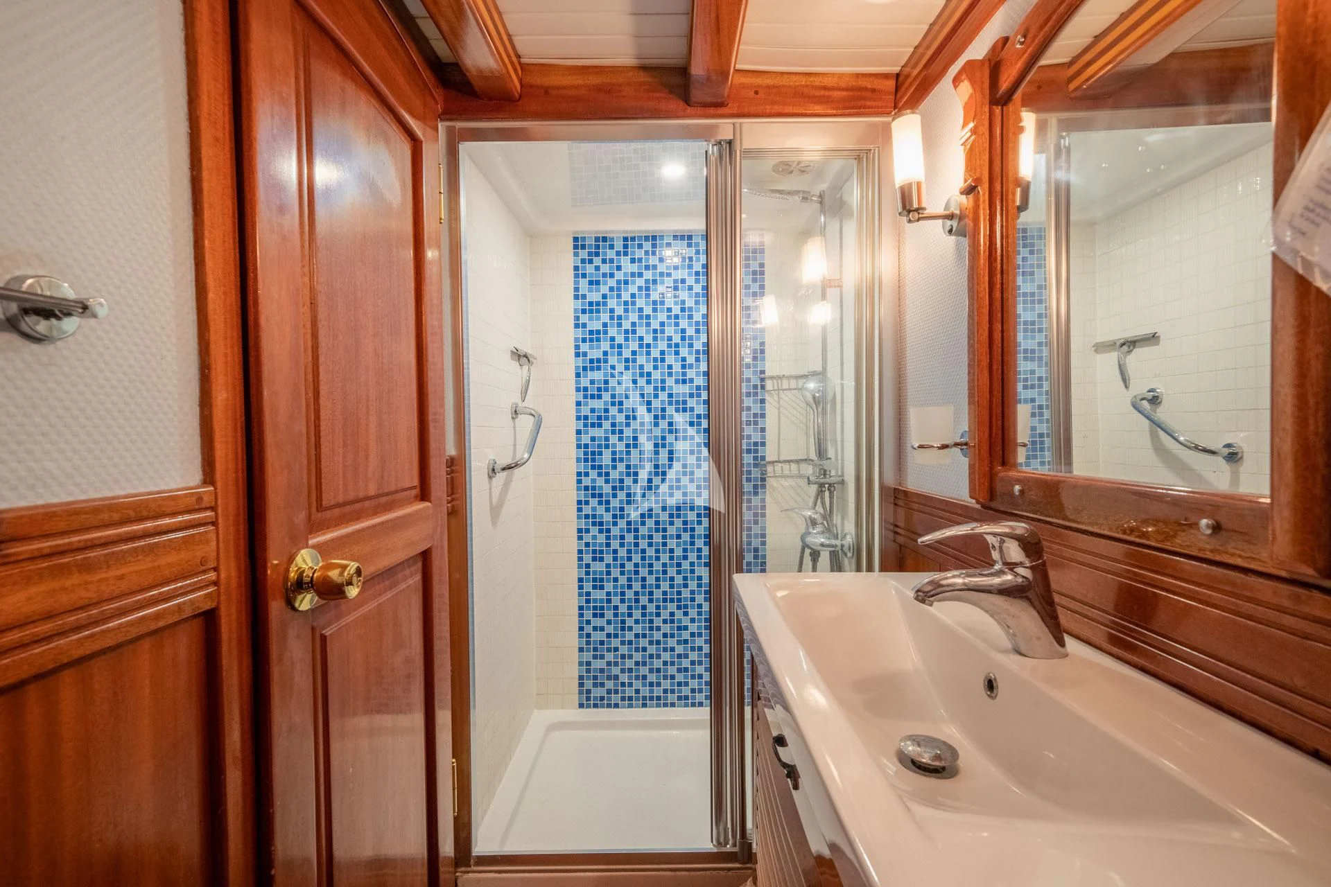 a bathroom with a sink and a shower aboard ADMIRAL Yacht for Charter