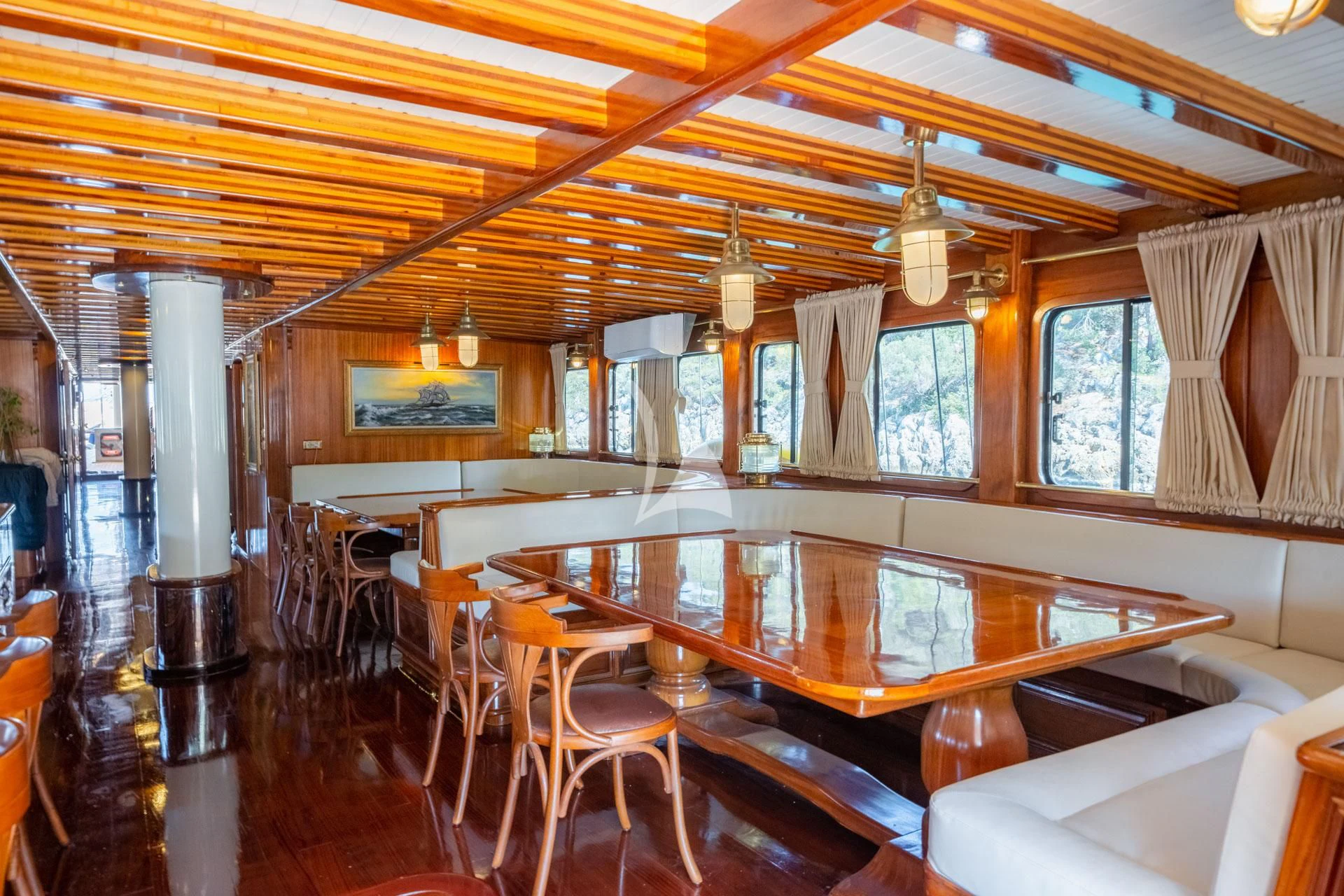 a room with a table and chairs aboard ADMIRAL Yacht for Charter