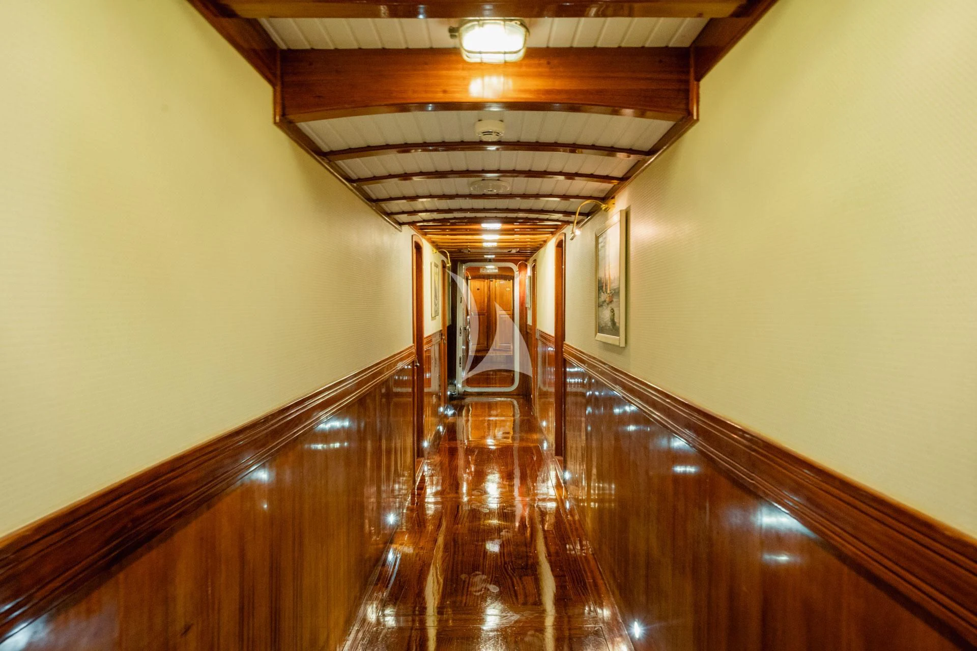 a long hallway with wood floors with Space Needle in the background aboard ADMIRAL Yacht for Charter