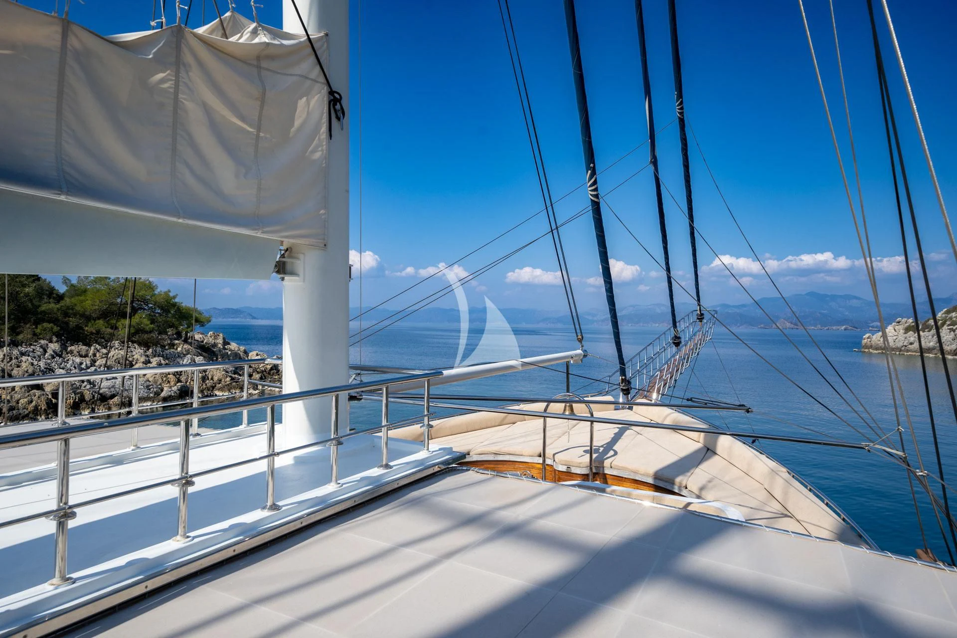 a large white boat on the water aboard ADMIRAL Yacht for Charter