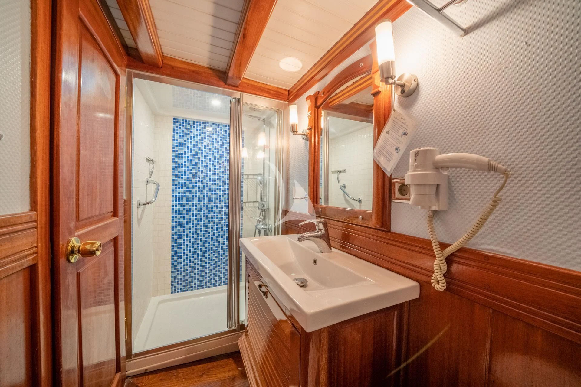 a bathroom with a sink and a mirror aboard ADMIRAL Yacht for Charter