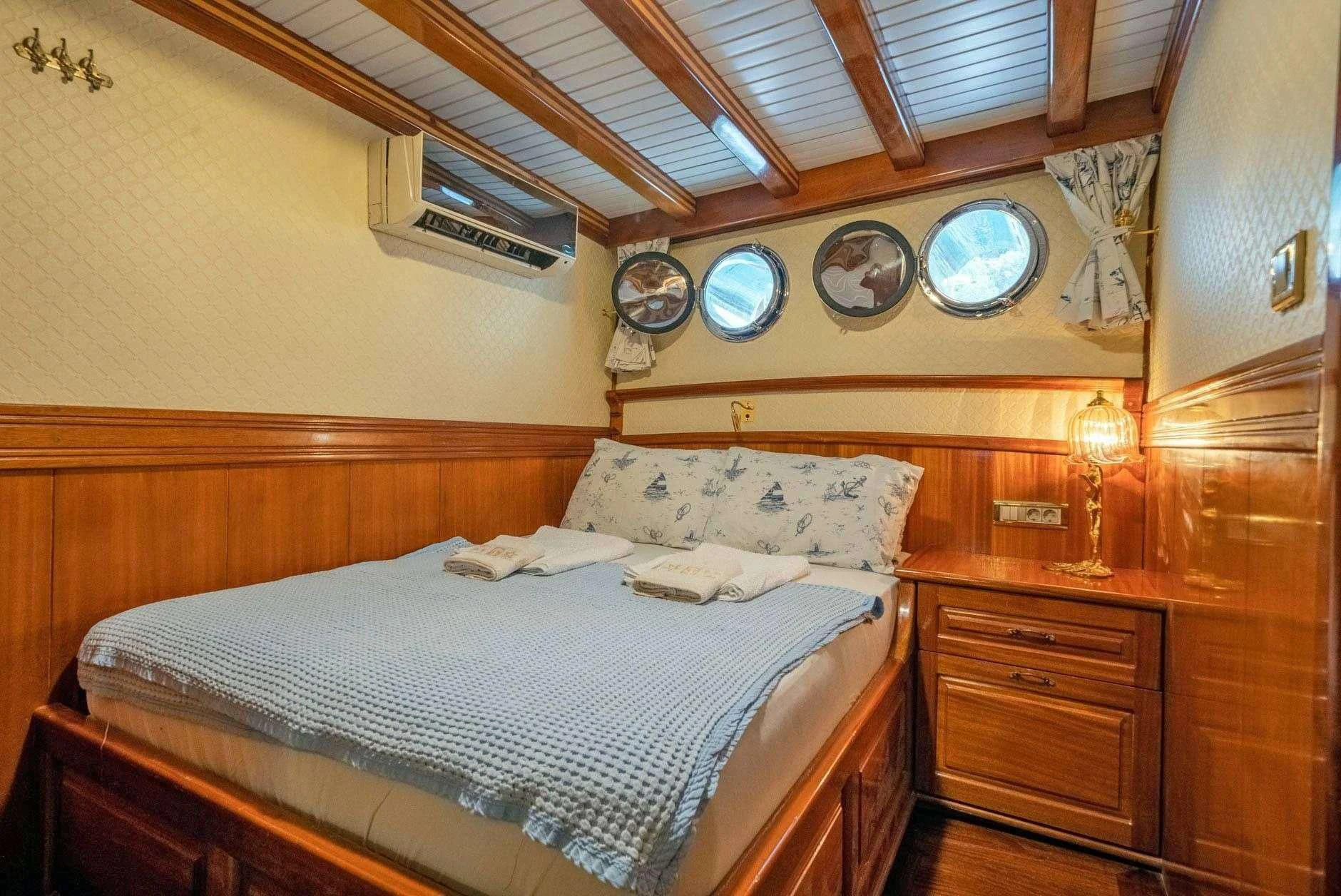 a bed with a couple of beds aboard ADMIRAL Yacht for Charter