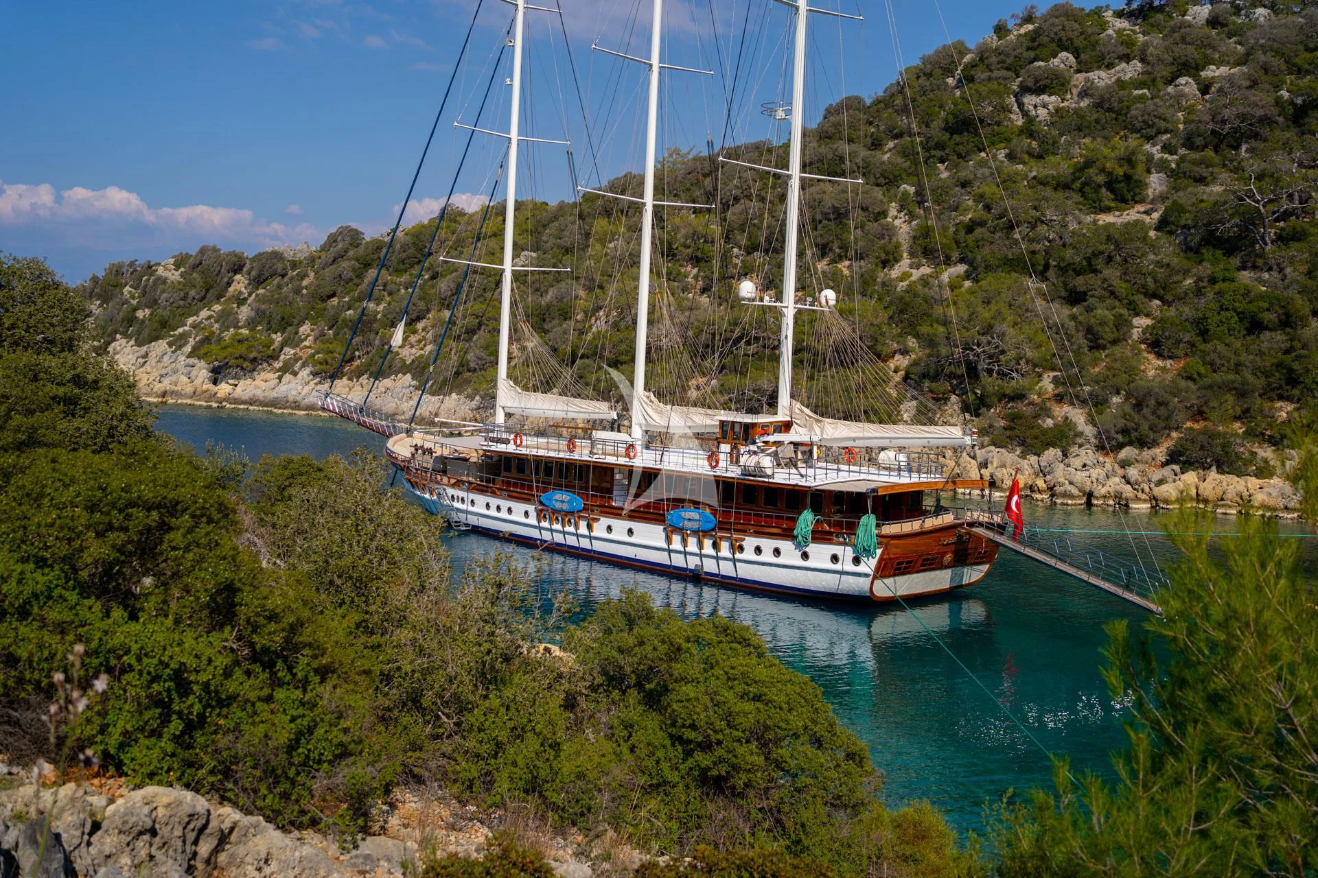 a boat docked at a bay aboard ADMIRAL Yacht for Charter