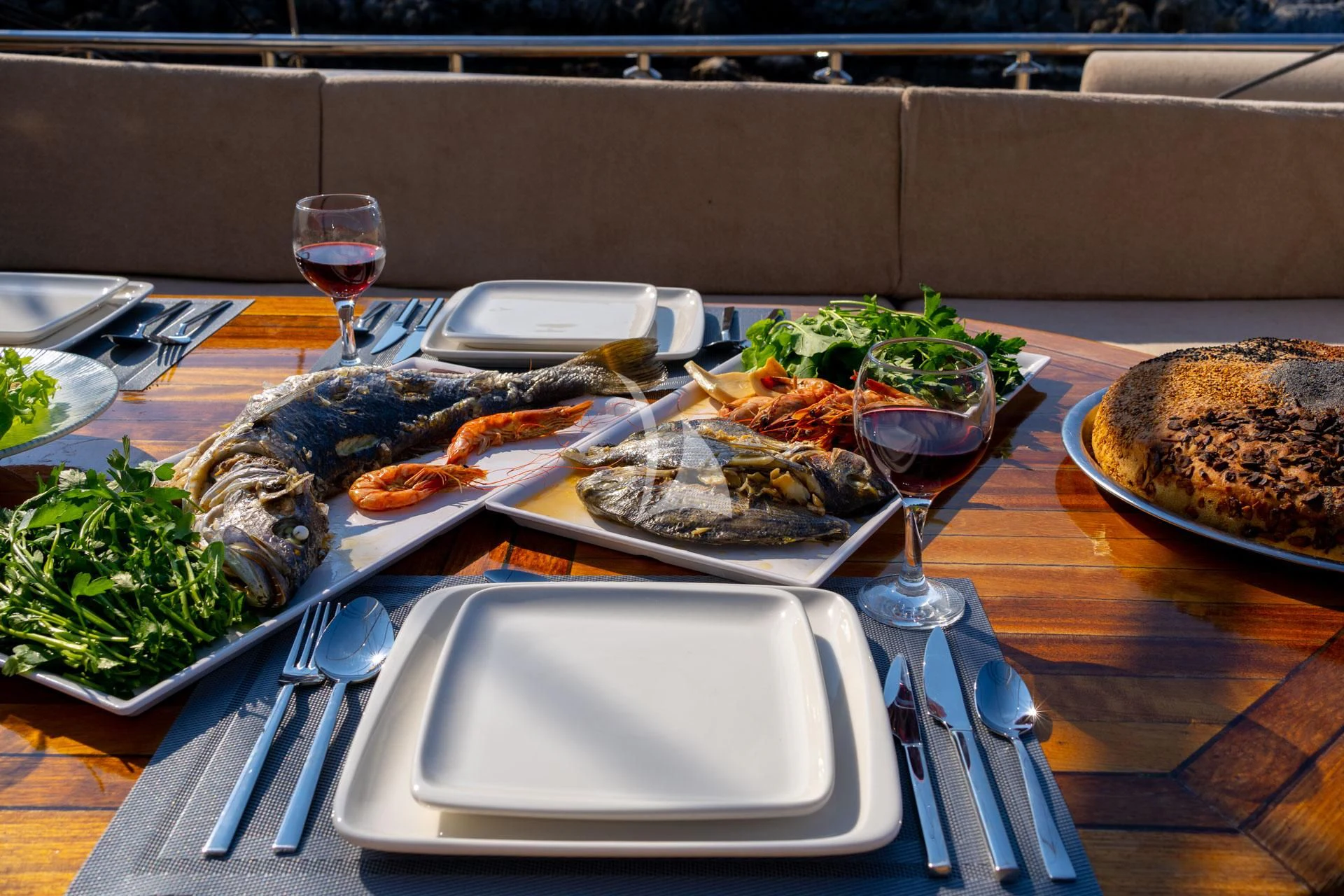 a table full of food aboard ADMIRAL Yacht for Charter