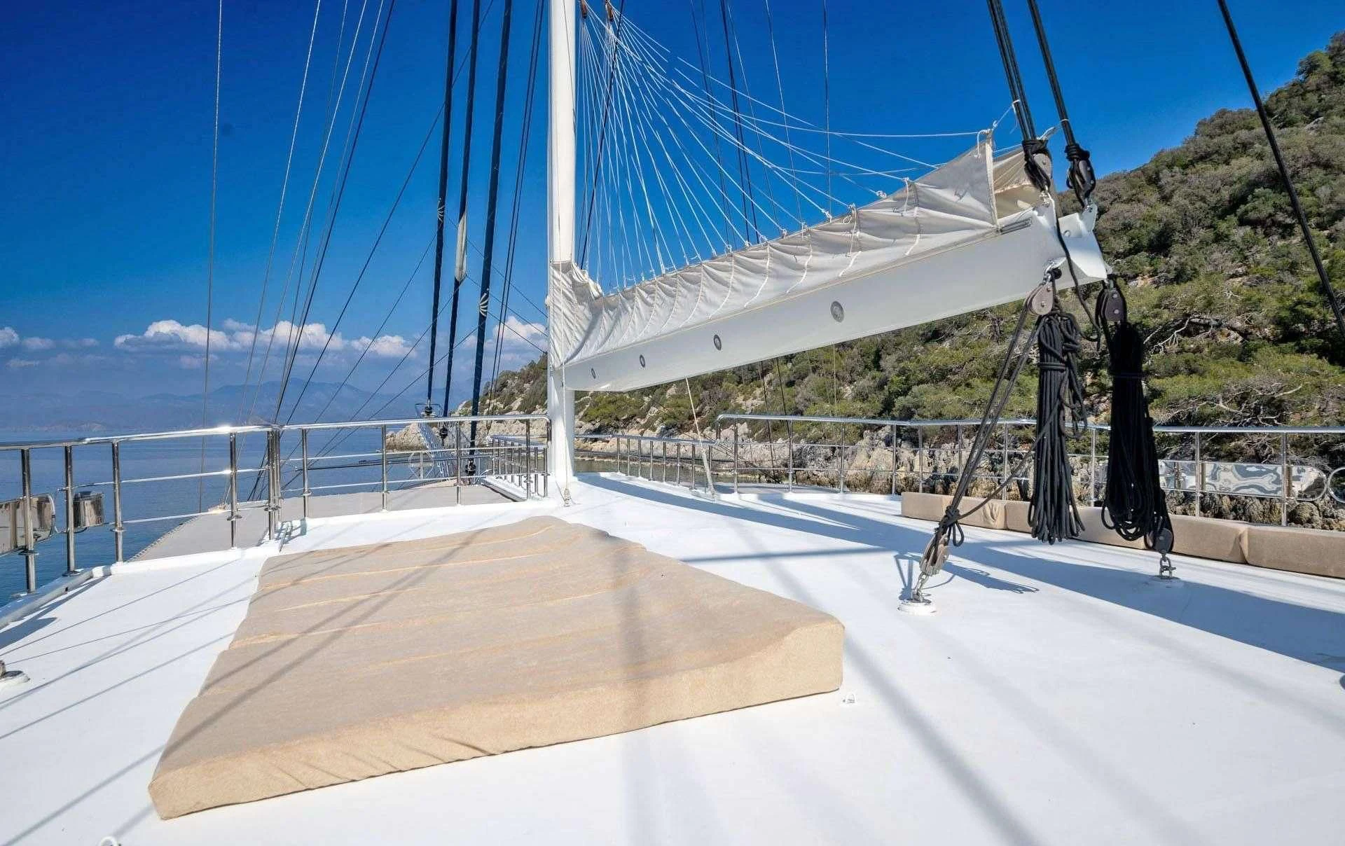 a large white tent on a beach aboard ADMIRAL Yacht for Charter