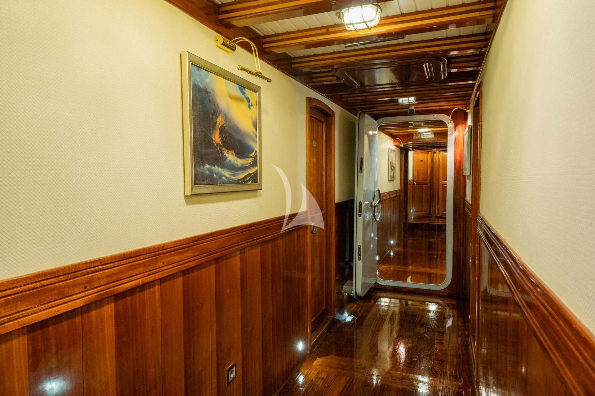 a hallway with wood cabinets aboard ADMIRAL Yacht for Charter