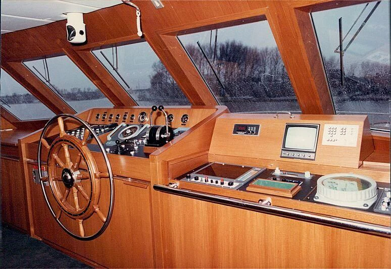 a wooden table with a machine on it aboard ORION Yacht for Sale