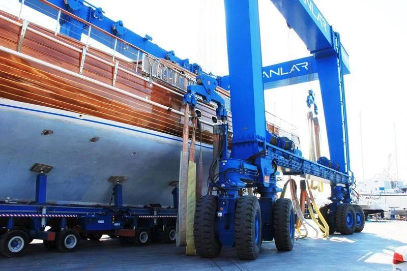 a large blue truck with a trailer aboard TAKE IT EASIER Yacht for Sale
