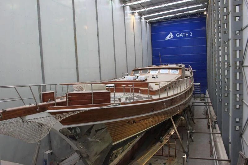 a boat in a warehouse aboard TAKE IT EASIER Yacht for Sale